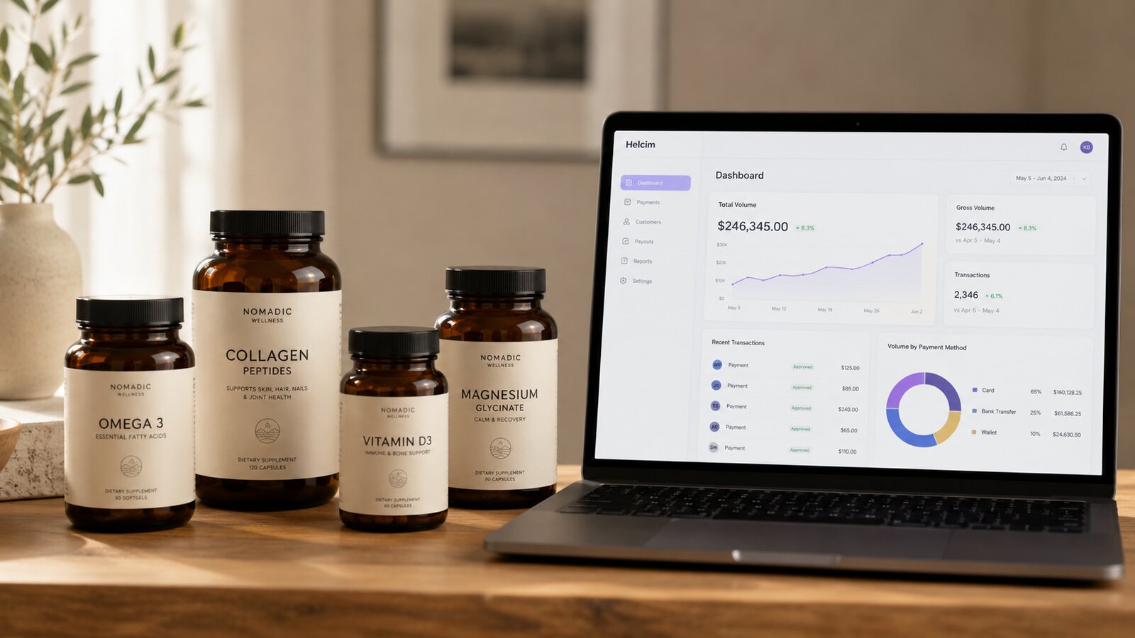 Amber glass supplement bottles on a wooden shelf beside a laptop showing a payment-processor dashboard.